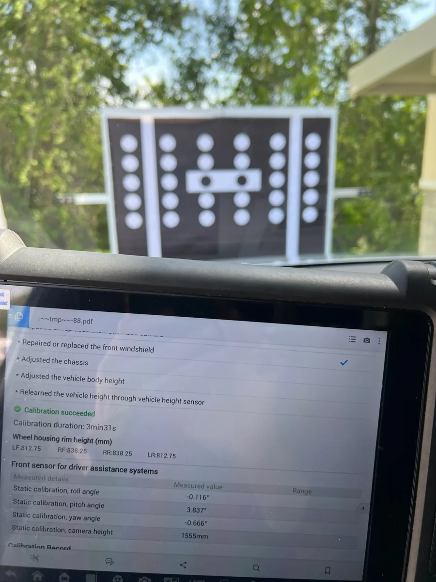 Scan tool showing calibration succeeded with a static target in front of an Audi Q7 in St. Cloud, FL