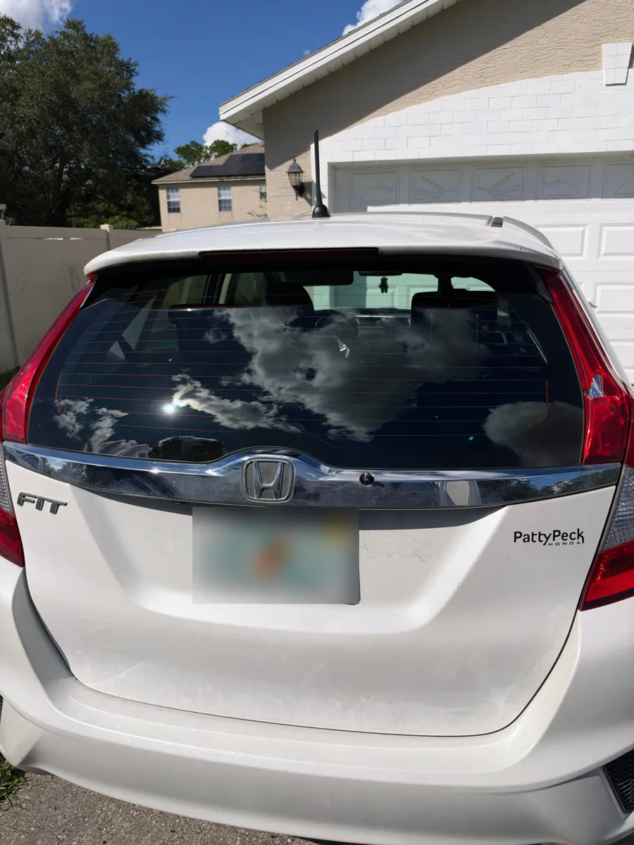 New back glass with defroster lines installed on a Honda Fit in Union Park, FL