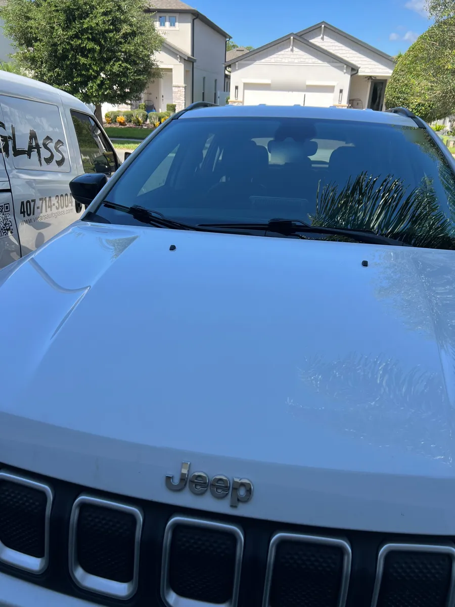 Jeep Compass with a new windshield next to the ViCars AutoGlass van in Lake Nona, Orlando FL
