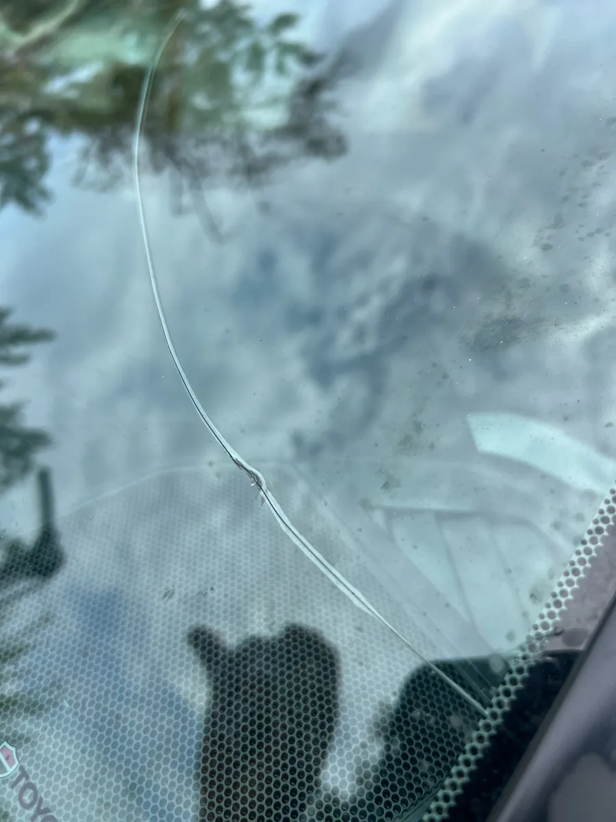 Long crack in the windshield of a Toyota Tacoma before replacement in Lake Nona, Orlando FL