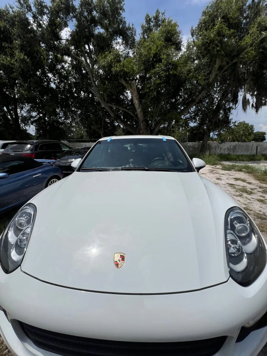 Porsche Cayenne with its new windshield and molding tape after replacement in St. Cloud, FL
