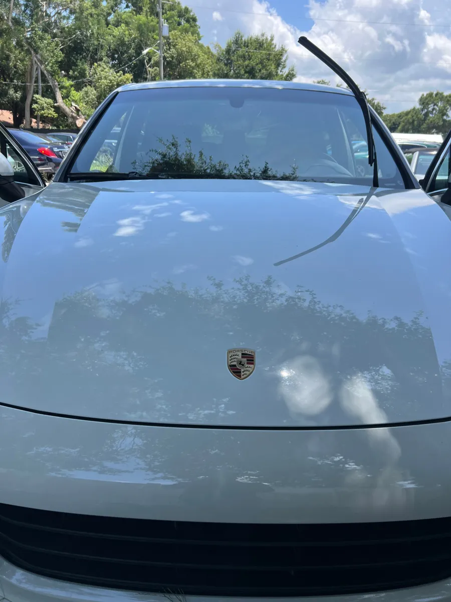 Porsche Cayenne with the wipers raised before windshield replacement in St. Cloud, FL